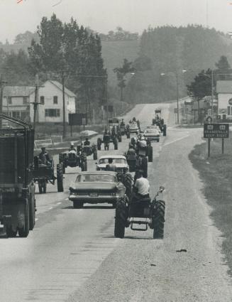 Two-way parade of Farmers' Tractors on Highway 10, What they want is $4 a hundredweight for manufactured milk