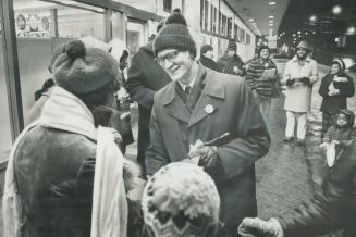 Singing carols outside the head office of Dominion Stores Ltd