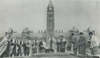 Rabbis sing and pray beside Centennial Flame in front of the Peace Tower on Parliament Hill today as Jews staged massive anti-Soviet protest. [Incomplete]