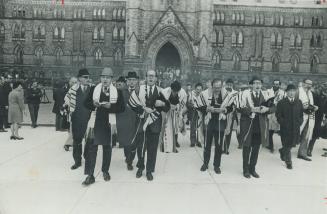 Chanting Rabbis keep vigil yesterday in front of the Parliament Buildings in Ottawa, part of a massive demonstration by 7,000 Jews who converged on Ott(...)