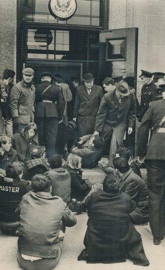 Thirty-eight University of Toronto students were hauled bodily from the U.S. Consulate on University Avenue