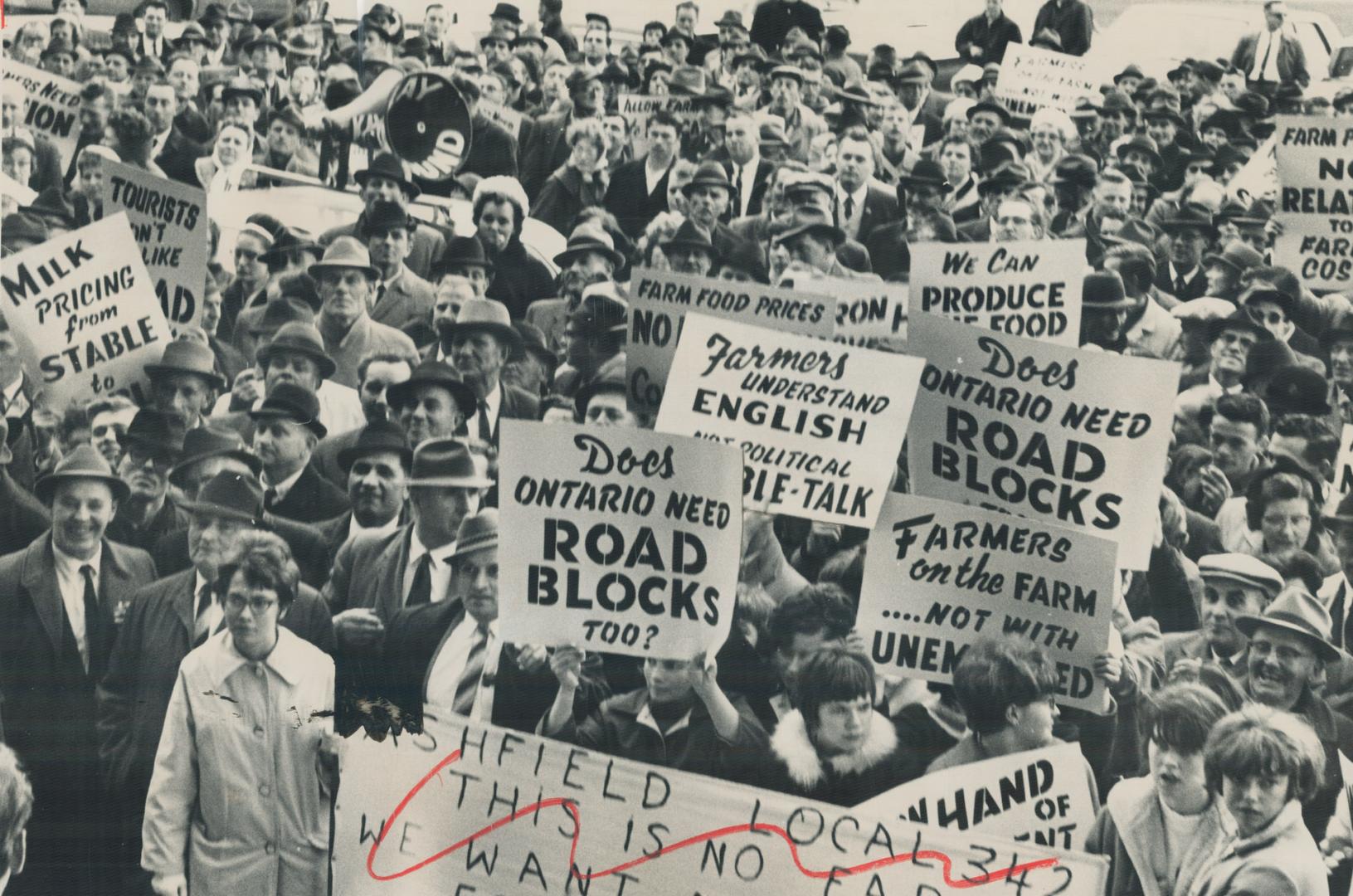 The farmers jammed against Queen's Park steps after Eddie Sargent (L, Grey North) won an argument with police