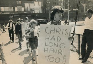 Villagers protesting 'police brutality' were kept to the public sidewalk, They planned to parade outside City Hall but were told they'd be arrested if they stepped on the square