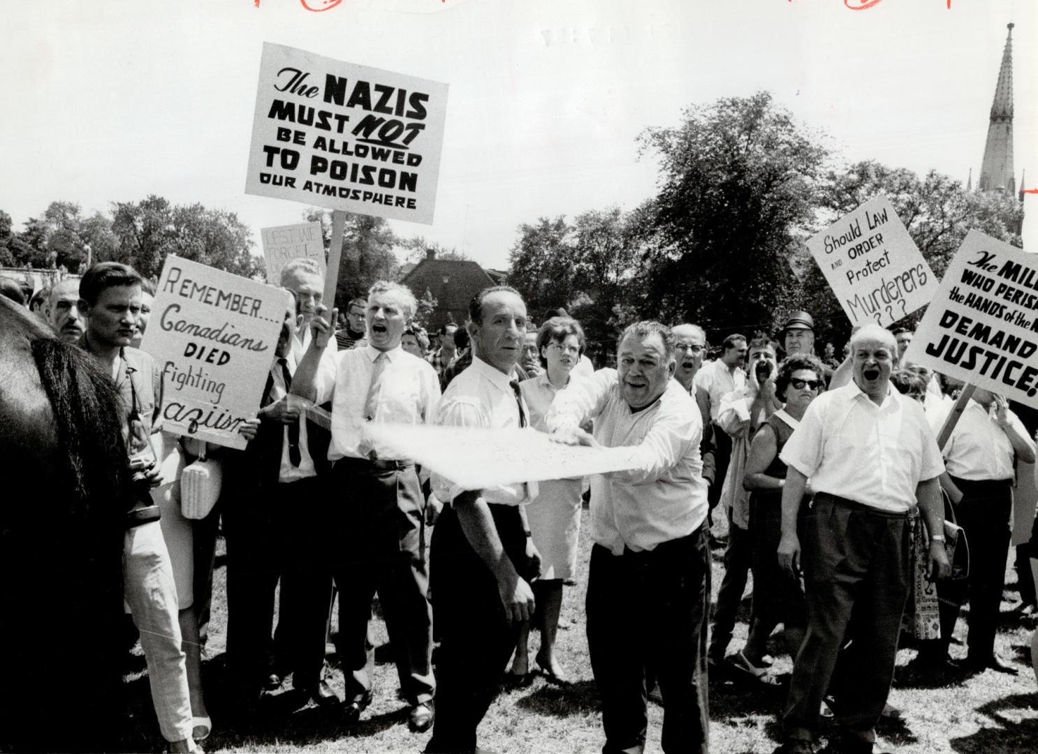 As crowd Jeers Beattie . . ., The reaction Canadian Nazi leader John Beattie received when he tired to speak in Allan Gardens Sunday was distinctly un(...)