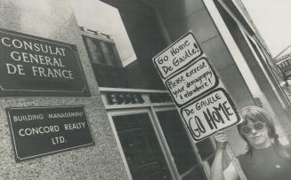 Hopping Mad citizen expresses her sentiments outside French Consulate