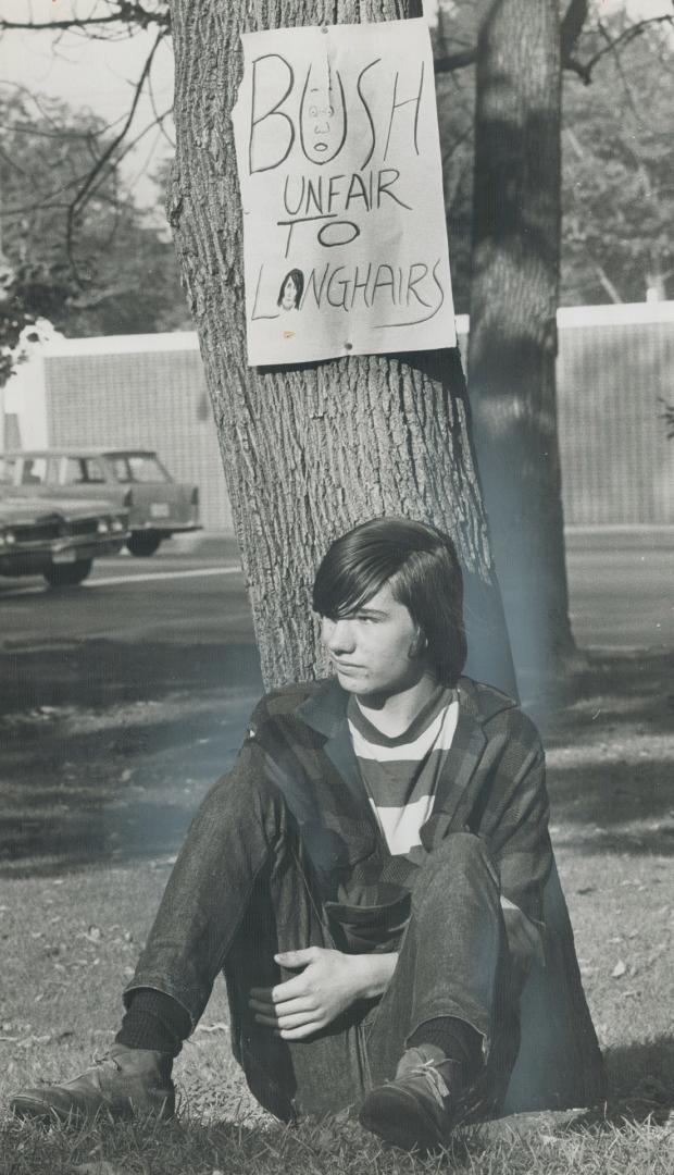 Castle Frank splits over hair, Castle Frank High School student John Nechoff, Grade 10-who wears his hair short-tears up pamphlets that were distribut(...)