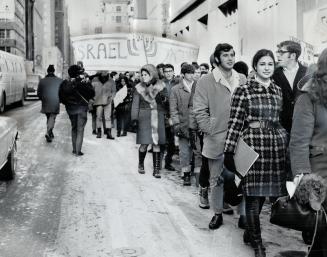 Reaction against French President de Gaulle's ban of all arms sales to Israel spread as far as Toronto, where these students staged demonstrations outside the French consulate