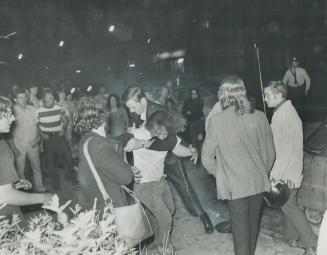 As crowd becomes angry at a concert at their newly-built People's Park beside Spadina Ave