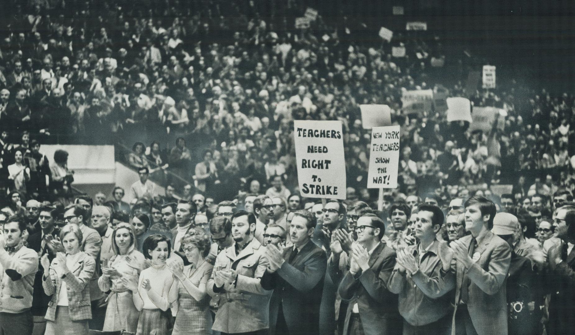 8,000 high school teachers stand at Maple Leafs Gardens to applaud a call for mass resignations of Metro secondary school teachers if the school board(...)