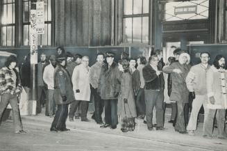 Mail sorters from the city delivery building picket the building today in a walkout protesting long delays in negotiations for a contract. [Incomplete]