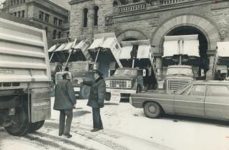 Too many licenses, Truckers say, Their boxes up, dump trucks surround Queen's Park today as about 150 drivers picketed to protest recent regulations t(...)