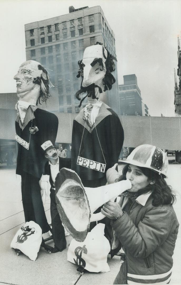 10-foot dummies representing Prime Minister Pierre Trudeau and Anti-Inflation Board chairman Jean-Luc Pepin were set up at Nathan Phillips Square toda(...)