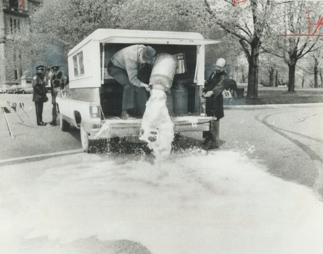 A river of milk flowed at Queen's Park today as angry farmers protested against milk quotas imposed on them this year by federal marketing board. [Incomplete]