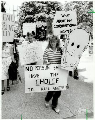 At right, anti-abortionists march outside the Ontario Supreme Court in Toronto