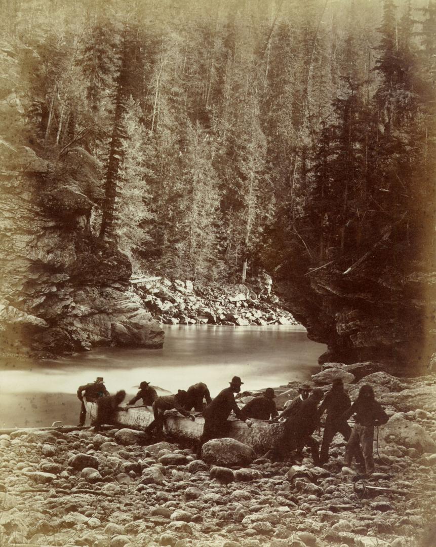 Portaging canoes at Upper Gate of Murchison's Rapids