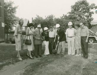 Group outside Dufferin St Clair library turning sod for renovation