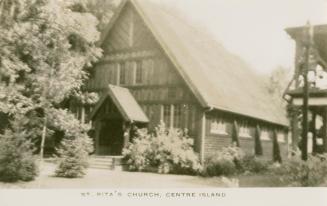 Black and white photograph of a timbered country church.