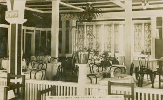 Shows the interior of a dining room.