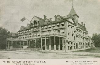 Black and white photograph of a four story hotel with a veranda across the front. Rates $2 to $…