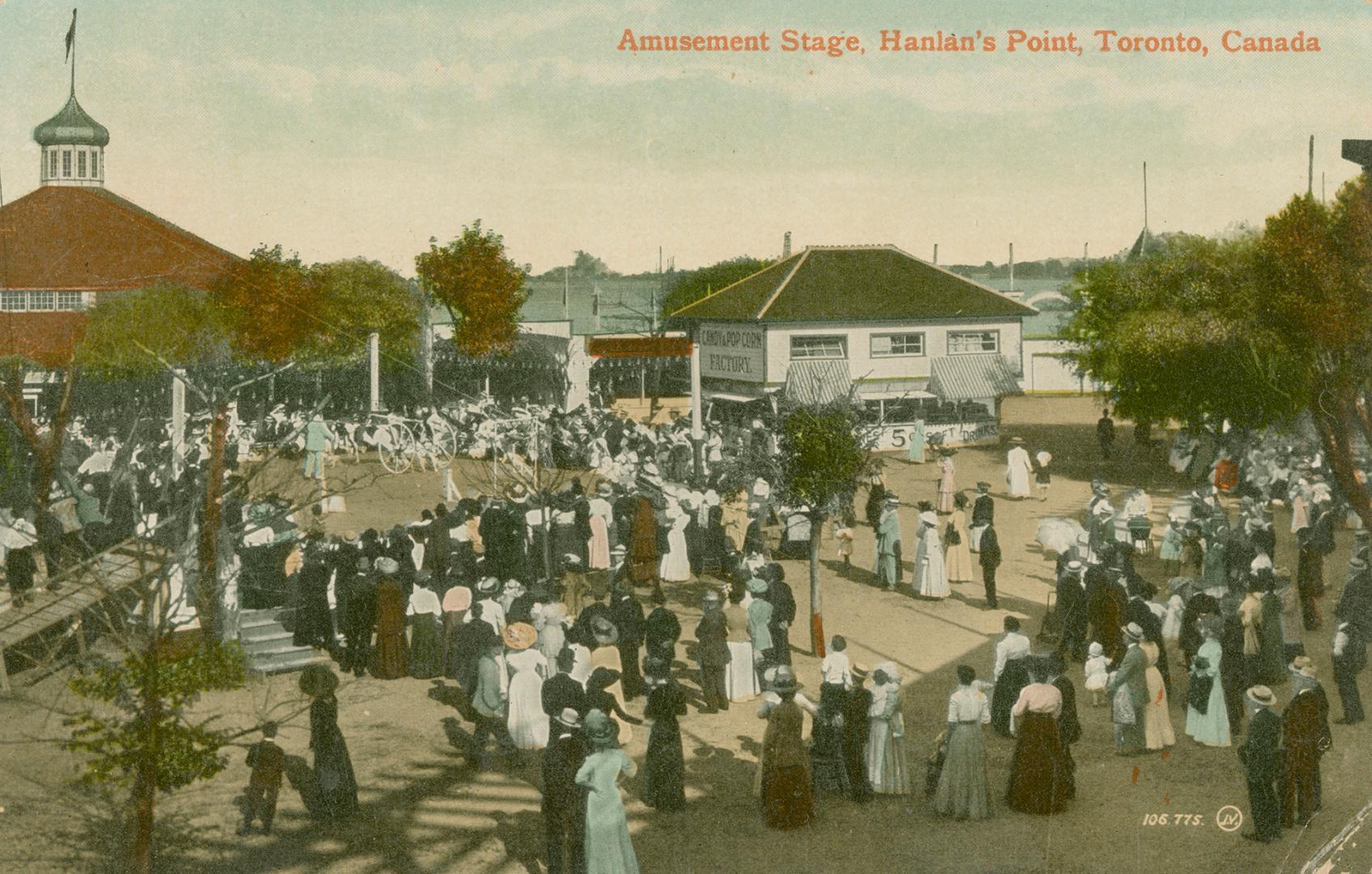 Large group of people at the entrance to an amusement park.