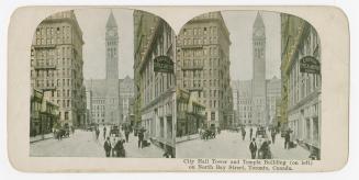 Pictures show a busy city street with a clock tower of an large government building in the back…