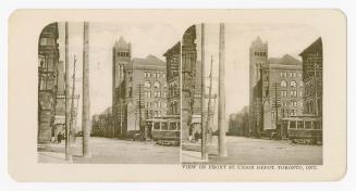 Shows Grand Union Hotel across from Union Depot. A streetcar is passing.