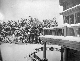 A photograph of a house taken from the second floor.