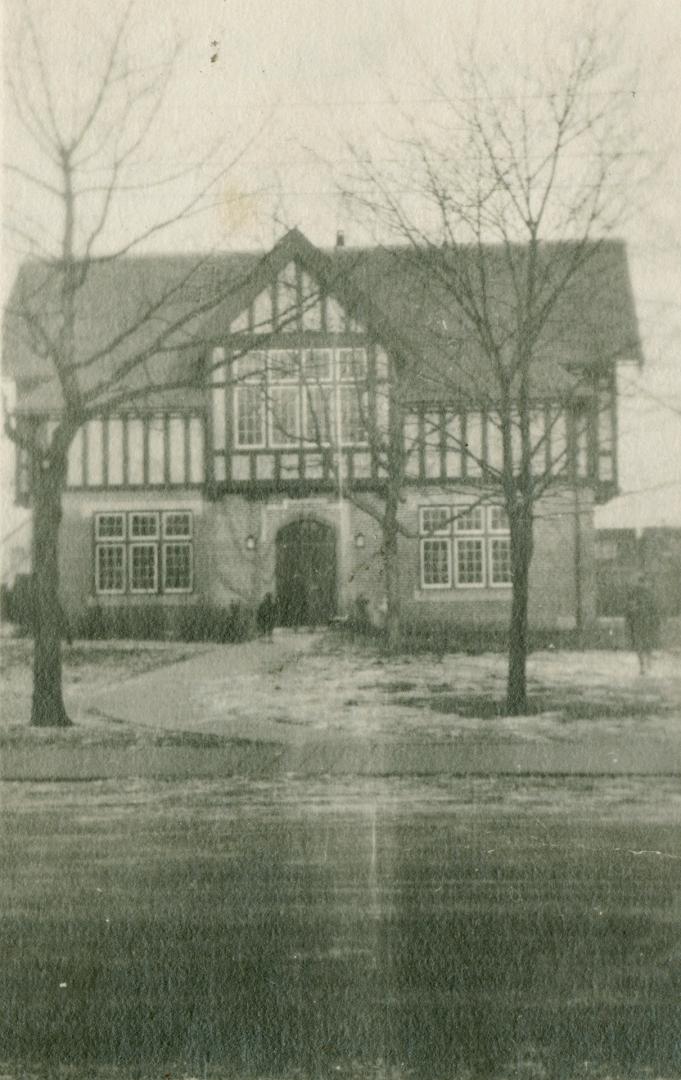 Eastern Branch library building with two trees in front