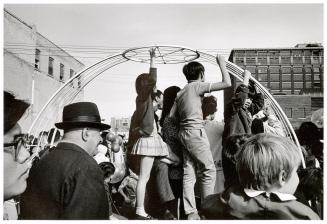 A photograph of a group of spectators at an outdoor event in downtown Toronto.