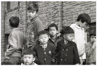 A photograph of spectators at an outdoor event in downtown Toronto.