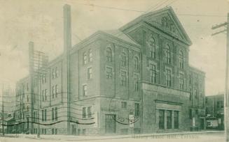 A black and white photograph of a large public building.