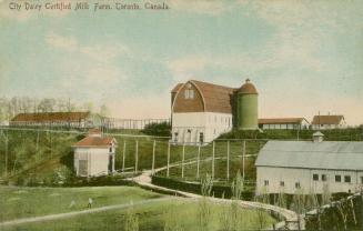 Colorized photograph of a barn with other farm buildings.