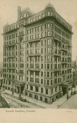 Back and white photograph of a large Victorian building.