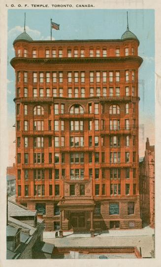 Colorized photograph of a large, Victorian office building.