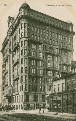 Black and white photograph of a large, Victorian building.