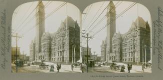 Pictures show a large Victorian government building with a bell tower.