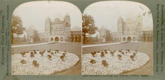 Pictures show a huge, Victorian style government building from the front, at a distance.