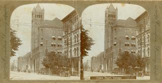 Pictures show a grand entrance archway and a tower attached to a large building.