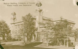 Sepia toned photograph of a large building with two towers.