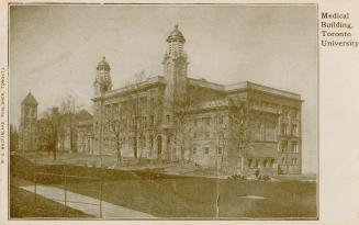 Black and white picture of a three story building with two towers.