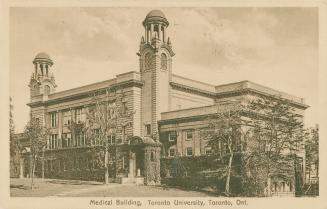 Sepia toned photography of a three story building with two towers.