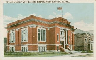 Colorized photograph of a two story brick building.