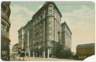 Colorized photograph of an eight story hotel building taken from an angle showing the front and…