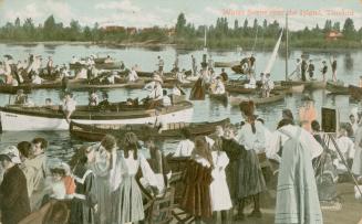 Colorized picture of a huge group of people in boats and watching from the shore.