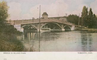 Colorized photograph of a wooden bridge crossing a narrow body of water.