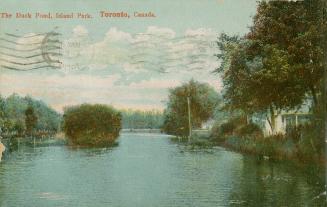 Colorized picture of a lagoon with a house to the right.