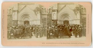 Pictures show a large group of students in caps and gowns standing in front of an elaborate doo…