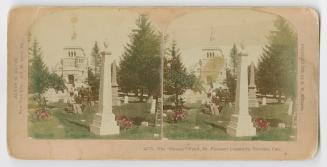 Picture show gravestones and monuments in a cemetery.