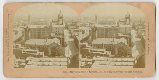 Pictures shoe an aerial shot of Toronto Looking east along Richmond Street from the top of a bu…