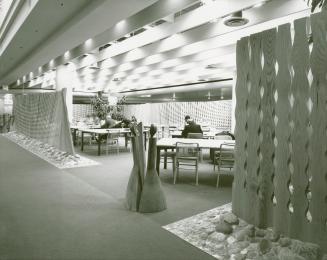 Picture of Metropolitan Toronto Library first floor area with study tables and people seated at ...